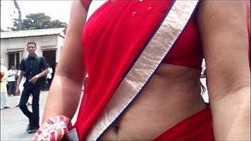 Red-Saree-Aunty-Showing-Deep-Navel